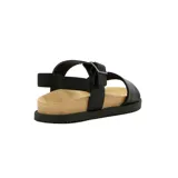 Sandalias bajas color marrón claro con tira ancha sobre los dedos y pulsera con hebilla dorada al tobillo.