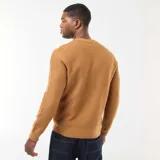 Sweater de punto fino con cuello redondo, diseño liso y mangas largas con puños acanalados.