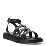Sandalias tipo franciscana de cuero negro con plataforma plana. Presentan tiras cruzadas decoradas con tachas metálicas plateadas y cierre con hebilla ajustable en el tobillo.