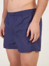 Bóxer Kevingston de algodón blanco con estampado integral de labios rojos. Cuenta con cintura elastizada y etiqueta de la marca en el frente.