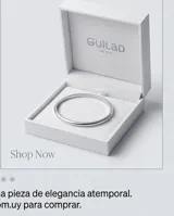 Esclava rígida de plata 925 con diseño minimalista y cadena de seguridad fina.
