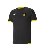 Camiseta deportiva Puma del Club Atlético Peñarol, modelo Team, color negro con detalles en amarillo en cuello y puños. Presenta el logo de Puma y el escudo del club en el pecho.