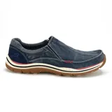 Mocasín Skechers Relaxed Fit Expected Avillo, color azul denim, con capellada de lona tejida y detalles en gamuza. Cuenta con plantilla Memory Foam y paneles elásticos laterales para facilitar el calce.