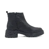 Botas de cuero marrón con suela track negra, diseño estilo Chelsea con inserciones elásticas laterales y cierre lateral.