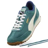 Championes urbanos Puma modelo Easy Rider Vintage, color verde esmeralda con detalles en blanco y suela de goma color caramelo. Presentan una combinación de materiales en gamuza y tela técnica, con el logo de la marca en dorado en el lateral.