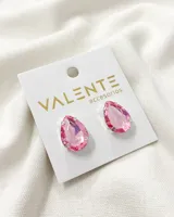 Aros colgantes con forma de lágrima, con cristal rosado y engarce plateado.