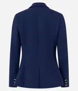 Blazer cruzado de sastrería en color azul marino, con corte slim y estructura entallada. Presenta solapas de muesca, cierre frontal con seis botones dorados metálicos con relieve, bolsillos con solapa en los laterales y mangas largas.