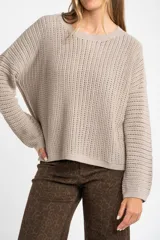 Sweater celeste de tejido de punto calado con lurex, de corte holgado y mangas largas.