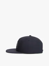 Gorra de béisbol Tommy Hilfiger de lona de algodón azul marino, diseño de seis paneles con visera plana y bordado frontal con el logo y una bandera náutica.