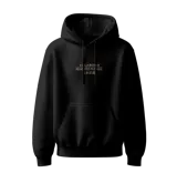 Hoodie negro con capucha ajustable con cordones, bolsillo canguro y estampado frontal en color dorado con el texto "VAGABOND MIYAMOTO MUSASHI" y caracteres japoneses.
