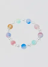 Pulsera elastizada con esferas de acrílico de colores pastel y perlas sintéticas.