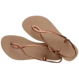 Sandalias tipo ojotas Havaianas modelo Luna, color rosado metalizado, con diseño de tiras entrelazadas y ajuste en el talón.