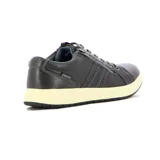 Championes casuales de hombre en color gris, con sistema de cierre mediante cordones y cremallera lateral decorativa. Presentan una suela de goma en tono crema y costuras reforzadas en el lateral.