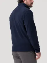 Buzo de polar color azul marino con cuello alto y cierre parcial de botones a presión en el frente. De manga larga y calce recto.