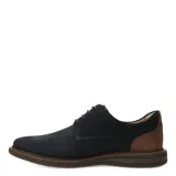 Zapato acordonado de hombre en color azul marino, con textura microperforada en el empeine y detalle de cuero en el talón. Cuenta con suela de goma en tono marrón.