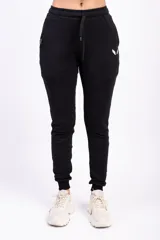 Pantalón de jogging gris con cintura elástica y logo de alas estampado en negro en el muslo.