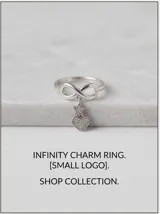 Anillo de plata 925 con diseño del símbolo del infinito y dijes colgantes en forma de estrella y corazón, ambos decorados con circonias.