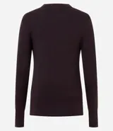 Suéter de punto ajustado con cuello redondo y manga larga. Presenta detalle de botones metalizados en los puños.