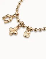 Charm en forma de herradura con acabado metálico brillante, diseñado para personalizar collares o pulseras.