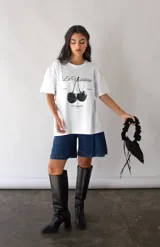 Cartera petite negra con asa fruncida convertible para usar corta, larga o cruzada.