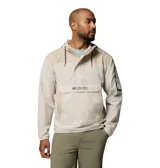 Campera Columbia modelo Challenger Windbreak Omni-Shield de color beige claro con detalles en tostado. Cuenta con capucha ajustable, media cremallera frontal, gran bolsillo canguro central con solapa y cierre de velcro, y puños elásticos.