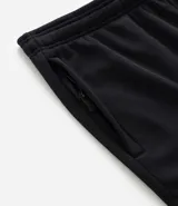 Pantalón deportivo de corte slim para hombre, confeccionado en poliéster color negro. Presenta cintura elástica con cordón de ajuste, bolsillos laterales y diseño ajustado en muslos y rodillas.