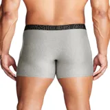 Pack de tres boxers Under Armour en tonos negro, gris oscuro y gris claro, con cintura elástica ancha con el logo de la marca estampado.