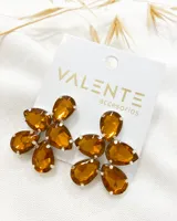 Aros colgantes con forma de flor, con engarce plateado y cristales color ámbar.