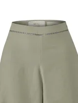 Pantalon de lino organico color verde militar, de corte recto y tiro alto, con sutil detalle de calado en la cintura y en el borde inferior.