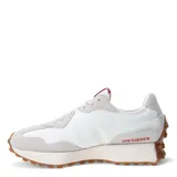 Championes urbanos New Balance modelo 327, con diseño retro inspirado en los años 70. Presentan una base de material sintético blanco con superposiciones de gamuza en tono gris claro, destacando el logo 'N' lateral en color rosado. Incluyen entresuela de espuma EVA y suela de goma dentada que se extiende hacia el talón.