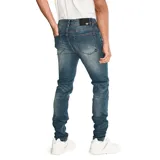 Jeans skinny para hombre, de corte ajustado y diseño de cinco bolsillos, con cierre de cremallera y botón metálico. Presenta un lavado azul medio con efecto desgastado.
