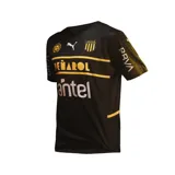 Camiseta de fútbol Puma del Club Atlético Peñarol, color negro con detalles en amarillo y blanco. Incluye logo de Puma, escudo del club, sponsor Antel y BBVA.