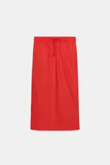 Falda midi de tiro medio confeccionada en algodón, con cintura elástica ajustable mediante cordones y bajo recto.