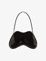 Bolso de hombro para mujer de Diesel, color negro, con forma orgánica y brillante, similar a un control de videojuegos. Posee un asa de hombro negra y un pequeño dije metálico con logo en el frente.