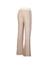 Pantalón de punto tejido color beige melange, de corte holgado y pernera recta con franja lateral en tono crudo. Cuenta con cintura elástica con cordón de ajuste en color crudo.