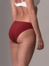 Bombacha clásica de talle bajo Calvin Klein Ideal Cotton, color borgoña, confeccionada en mezcla de algodón y elastano.