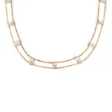 Collar doble de acero enchapado en oro con perlas irregulares.