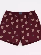 Bóxer de algodón blanco con estampado de flores pequeñas color celeste, con cintura elástica y logo de la marca en el centro.