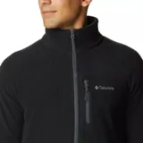 Campera Columbia Fast Trek II con cremallera completa, confeccionada en microfibra polar 100% poliéster. Cuenta con cuello alto, bolsillo en el pecho con cremallera y bolsillos laterales con cremallera. Presenta el logo de Columbia bordado en el pecho.