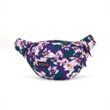 Riñonera JanSport modelo Fifth Avenue, con estampado floral sobre fondo morado y hojas verdes. Presenta un compartimento principal y un bolsillo frontal con cierre.