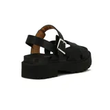 Sandalias de mujer Vizzano con tiras cruzadas blancas en el empeine, tira ajustable con hebilla metálica en el talón, y suela flatform negra con plataforma track.