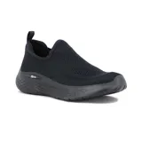 Championes de estilo casual marca Actvitta, confeccionados en tejido de punto negro con diseño sin cordones y suela de goma texturizada.