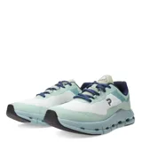 Championes deportivos unisex con diseño moderno, capellada de malla blanca y refuerzos en tono verde agua. Presentan una mediasuela voluminosa de color celeste con orificios laterales para mayor amortiguación y suela negra.