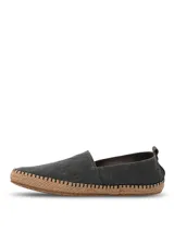 Alpargatas Hush Puppies modelo Hubert, color negro, con suela de yute trenzado y costuras decorativas. Diseño slip-on con elástico en el empeine.