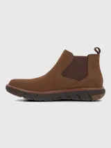 Bota tipo Chelsea de cuero color marrón, con paneles elásticos laterales y suela tecnológica Spinal Flex de color marrón oscuro que ofrece amortiguación y soporte.
