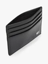 Tarjetero de cuero negro con diseño compacto y plano. Presenta múltiples ranuras para tarjetas y el logo metálico de la bandera de Tommy Hilfiger en la esquina inferior derecha.
