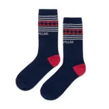 Medias de caña media color azul marino con diseño de rayas grises y puntos rojos en la parte superior. Presentan el logo de la marca Caterpillar tejido y detalles en color rojo en el talón y la puntera.