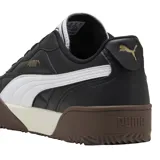 Championes Puma modelo Tifosi, de diseño urbano con capellada en color negro, detalle de franja lateral blanca y suela de goma en tonos marrón y crema.