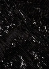 Leggings capri de corte skinny, confeccionados en tejido cubierto de lentejuelas negras. Presentan una cintura con elástico para un ajuste cómodo y un diseño sin cierre.