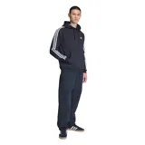 Canguro Adidas con capucha y cordones ajustables, color negro. Presenta las icónicas tres rayas blancas en las mangas y el logo del trébol bordado en el pecho. Incluye bolsillo frontal tipo canguro y puños acanalados.